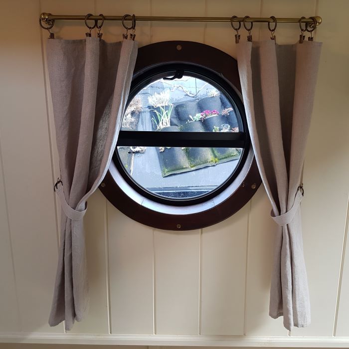 Porthole with curtains supplied by Skipperlings 700